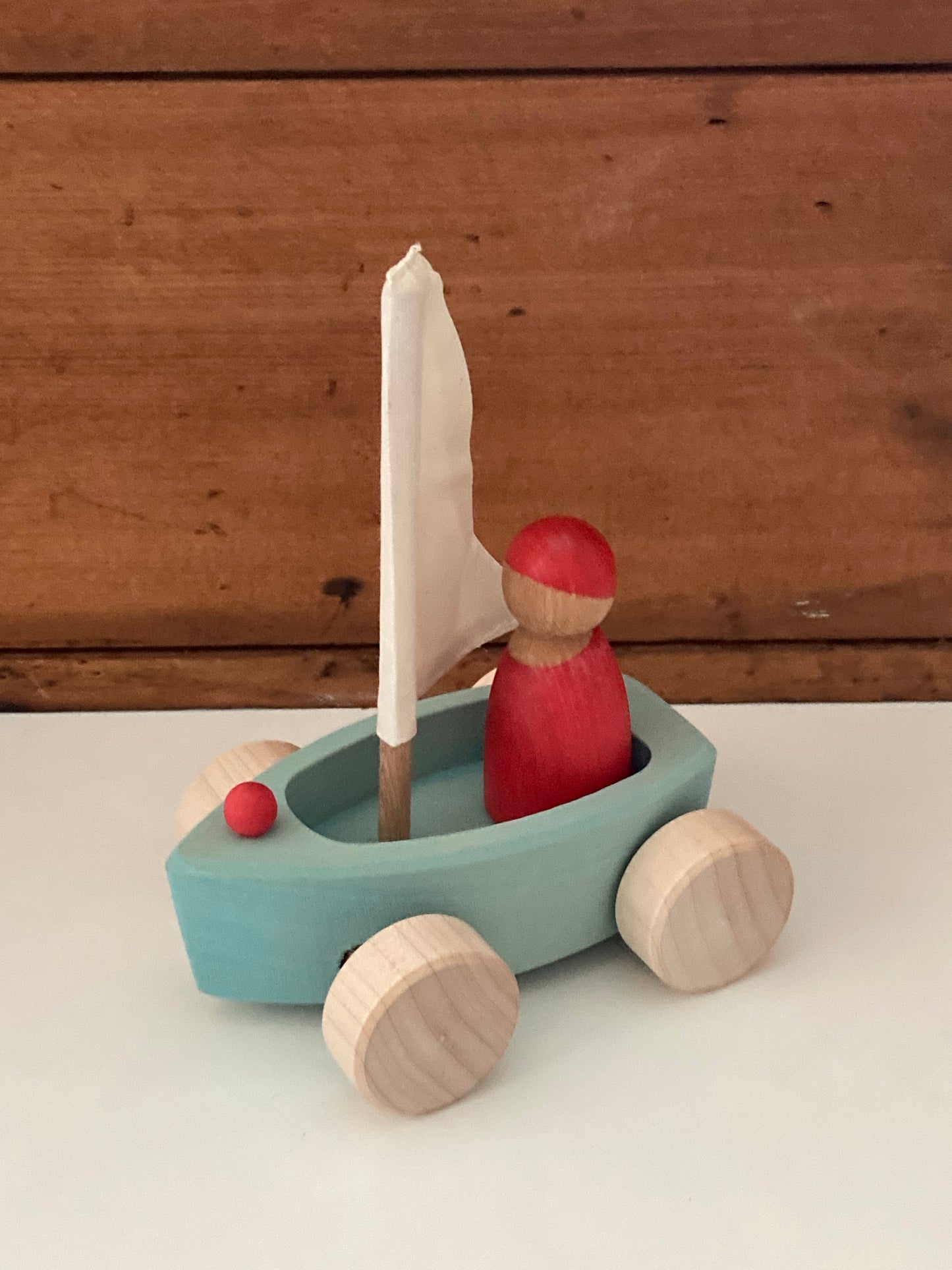 Wooden Toy - Grimm's SAILBOAT in BLUE and SKIPPER in RED… on wheels!