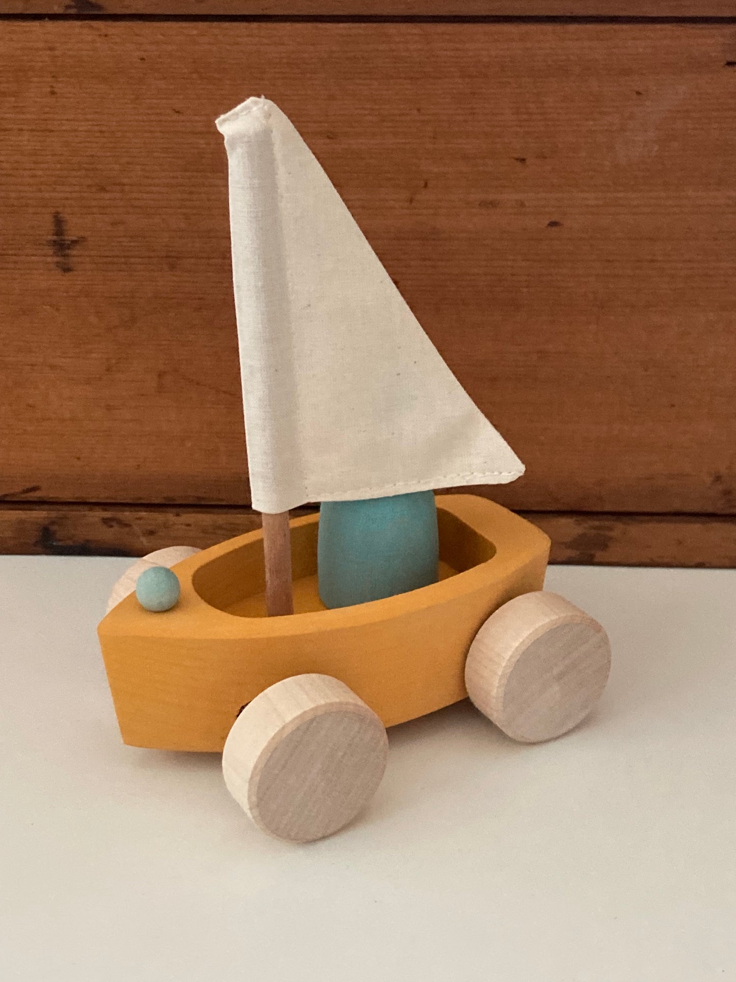 Wooden Toy - Grimm's SAILBOAT in YELLOW GOLD with SKIPPER in BLUE… on wheels!
