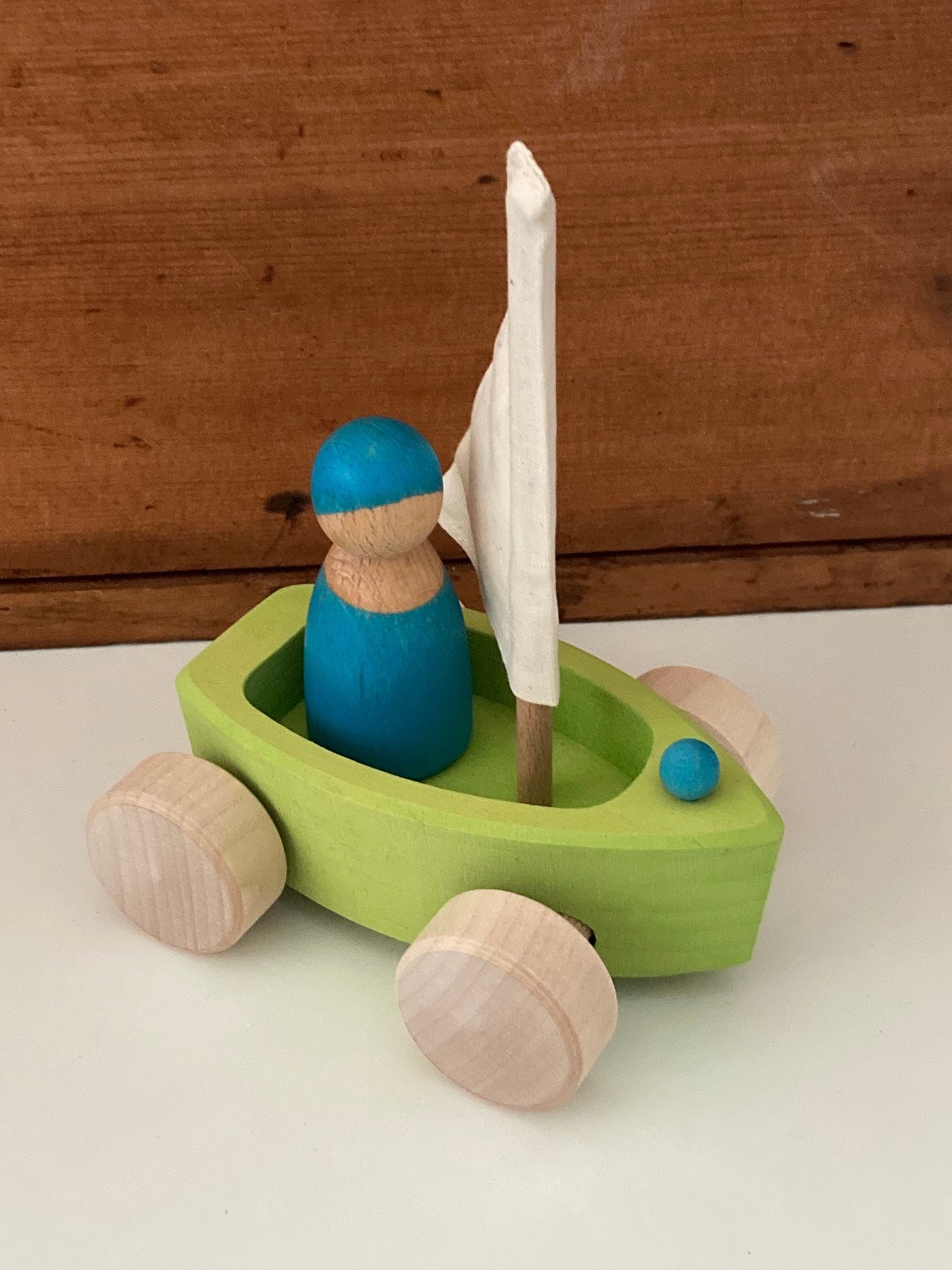 Wooden Toy - Grimm's SAILBOAT in GREEN, and SKIPPER in BLUE… on wheels!
