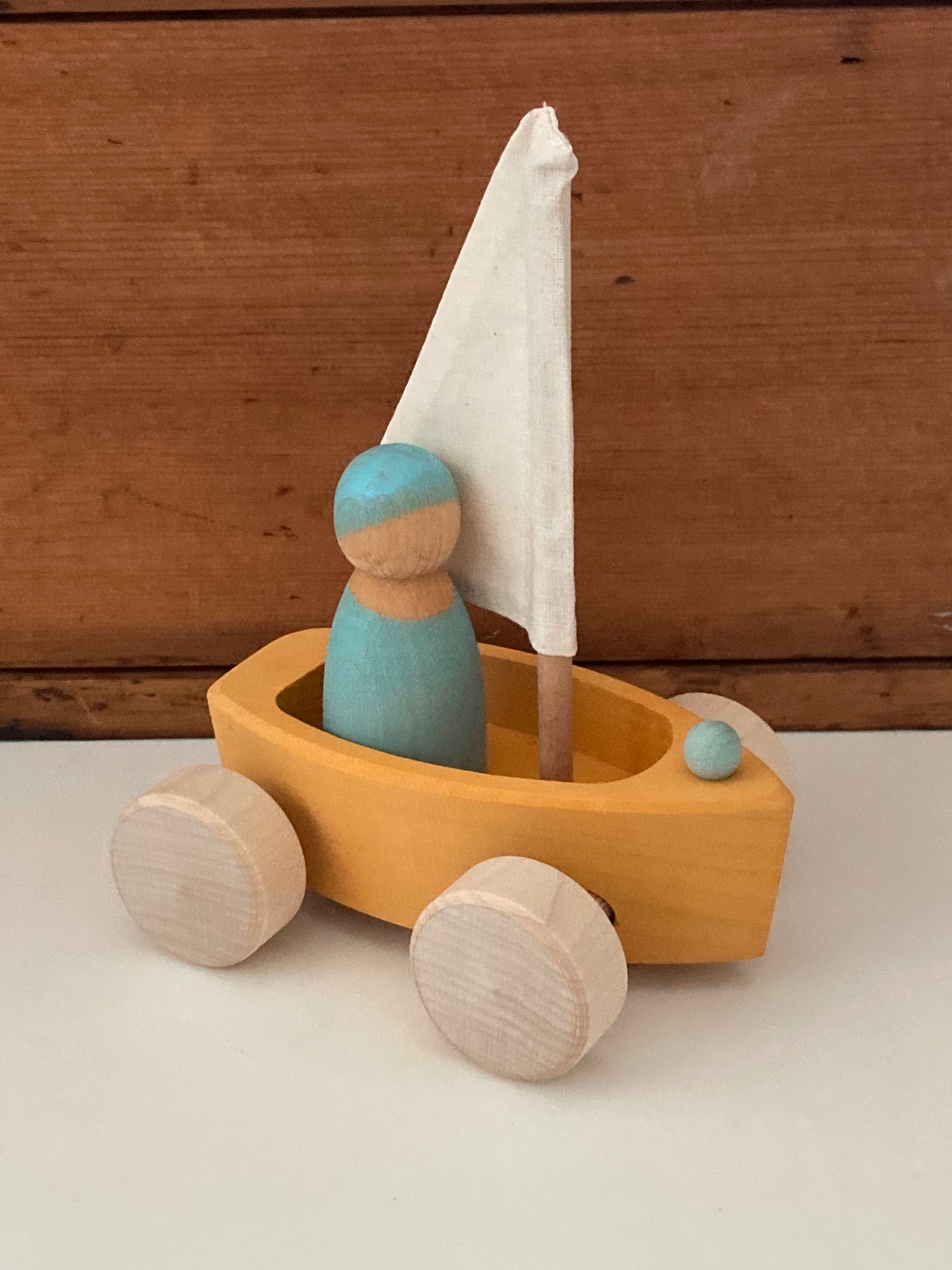 Wooden Toy - Grimm's SAILBOAT in YELLOW GOLD with SKIPPER in BLUE… on wheels!