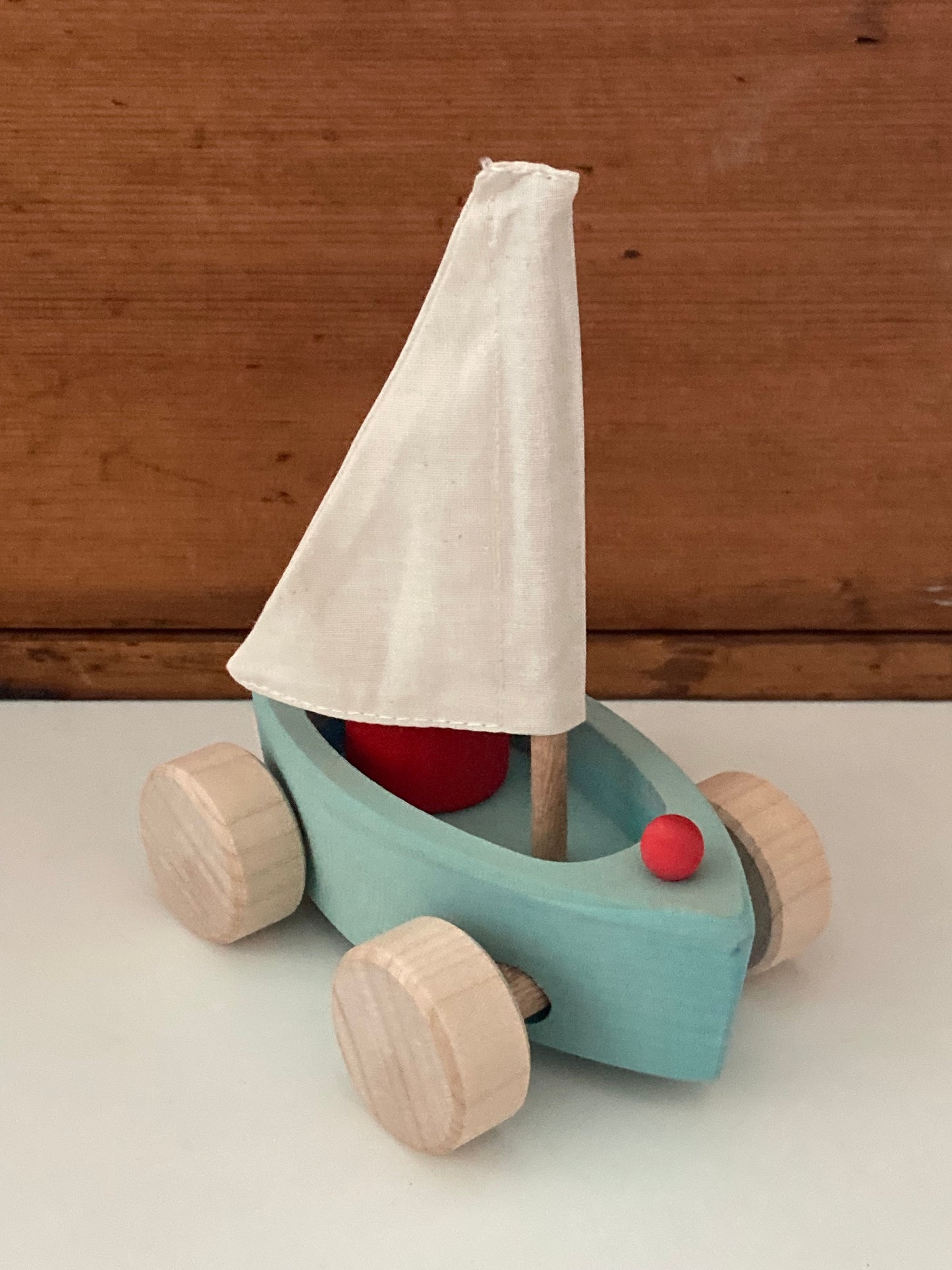 Wooden Toy - Grimm's SAILBOAT in BLUE and SKIPPER in RED… on wheels!