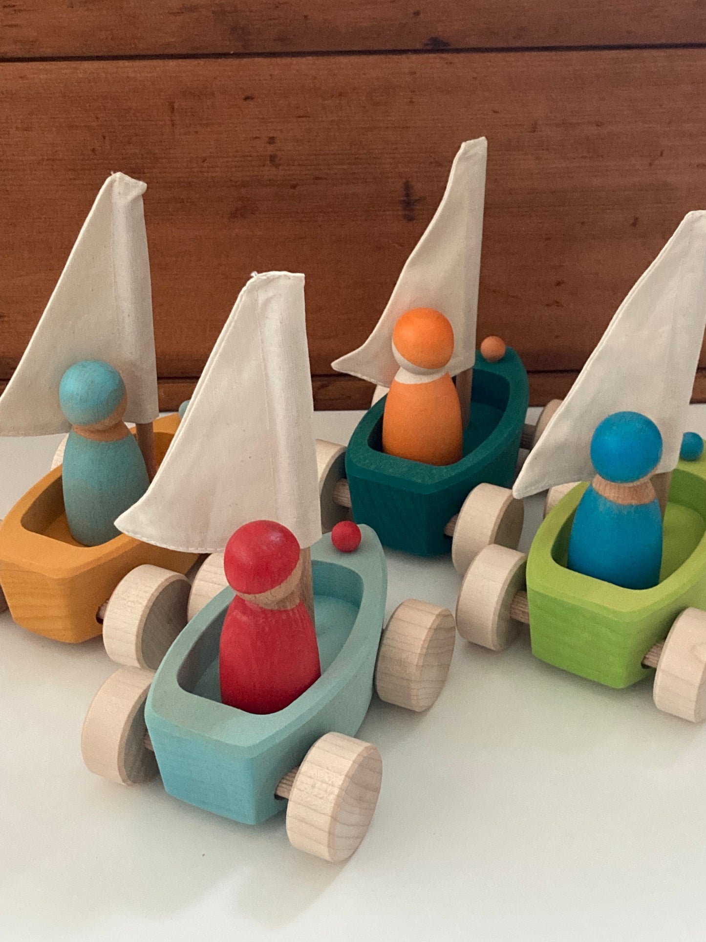 Wooden Toy - Grimm's SAILBOATS, on wheels, each with SKIPPER! (set of 4)