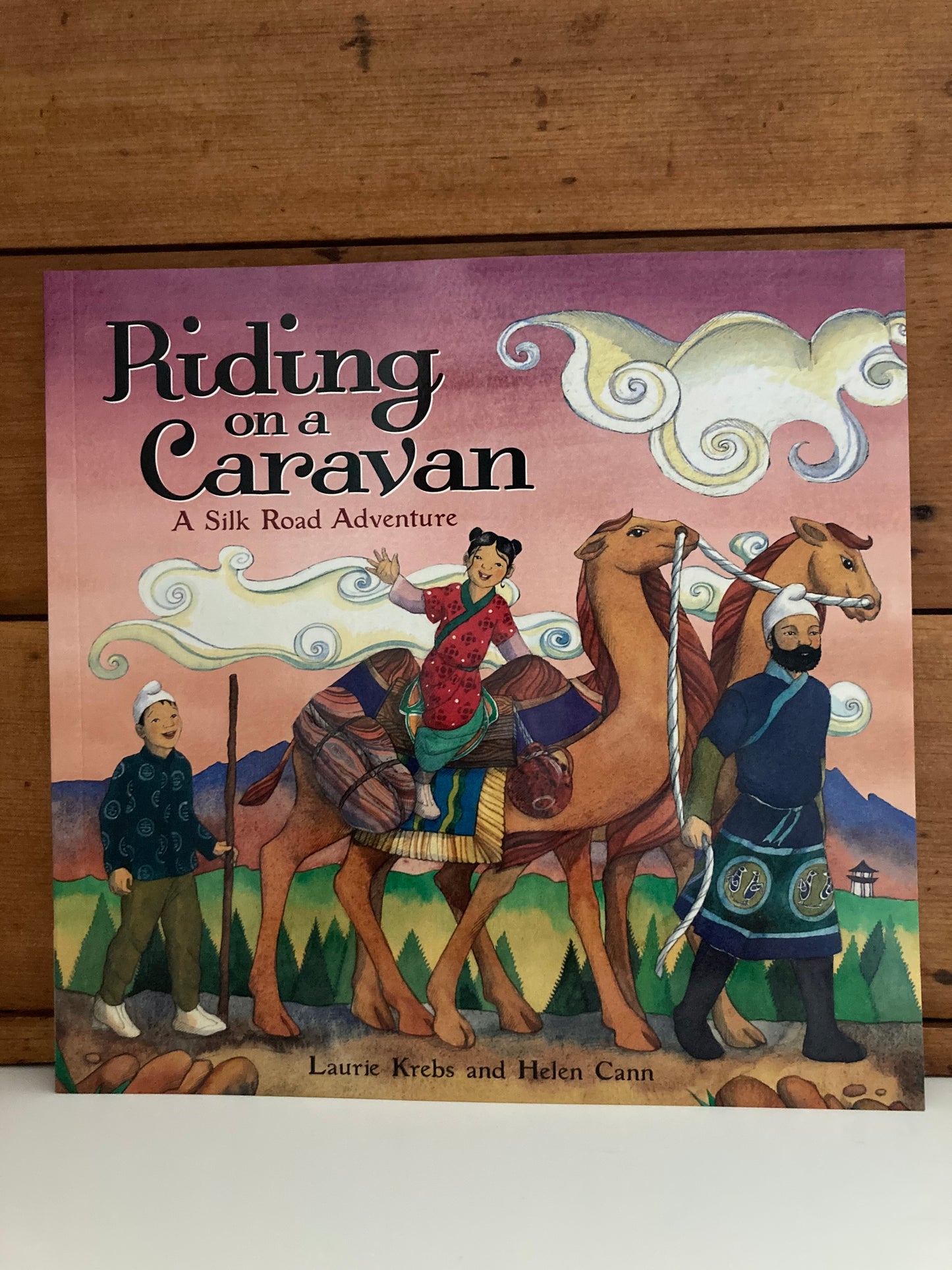 Livre d'images éducatif pour enfants - À cheval sur une caravane