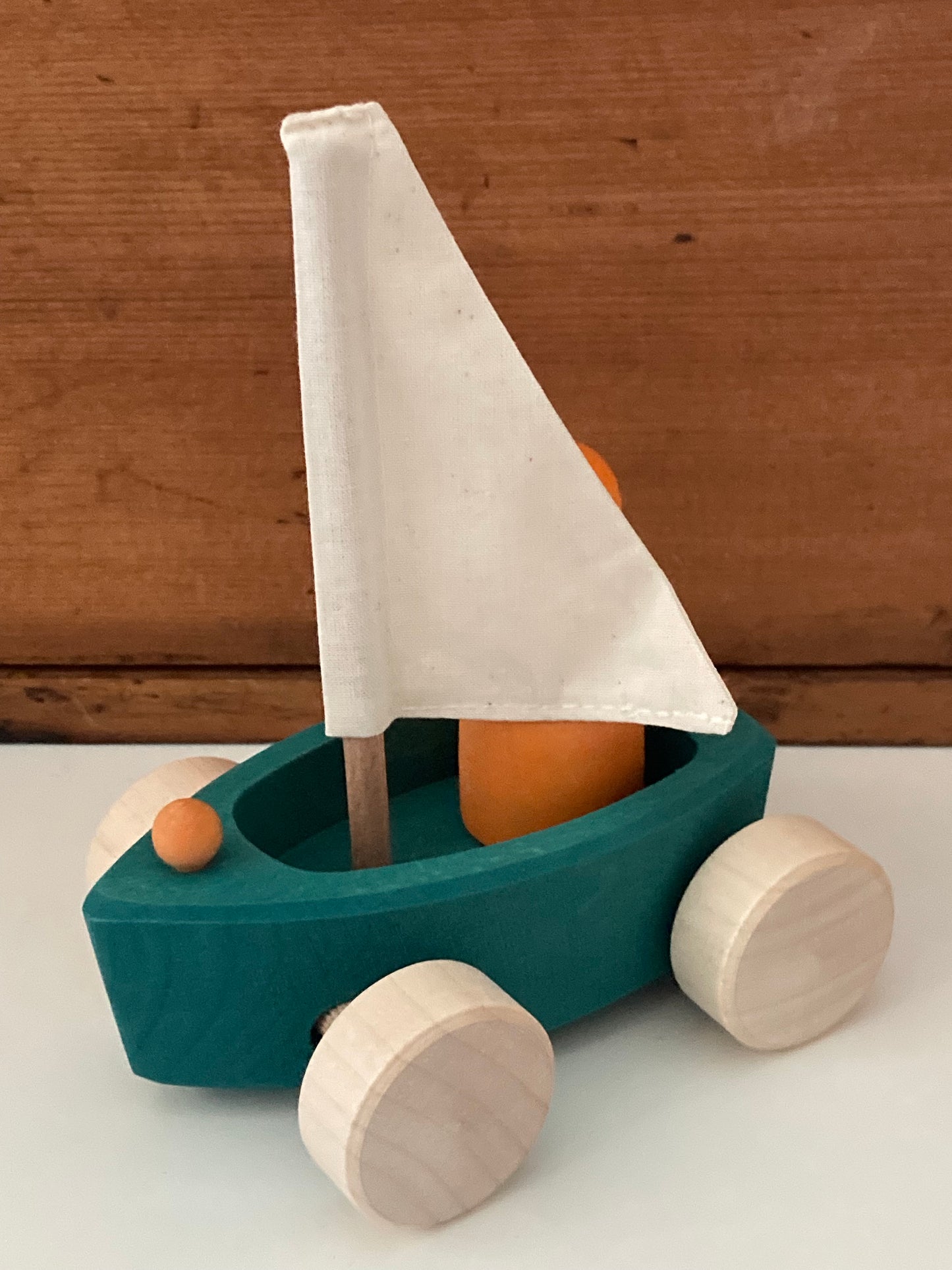 Wooden Toy - SAILBOAT in EVERGREEN and SKIPPER in ORANGE… on wheels!