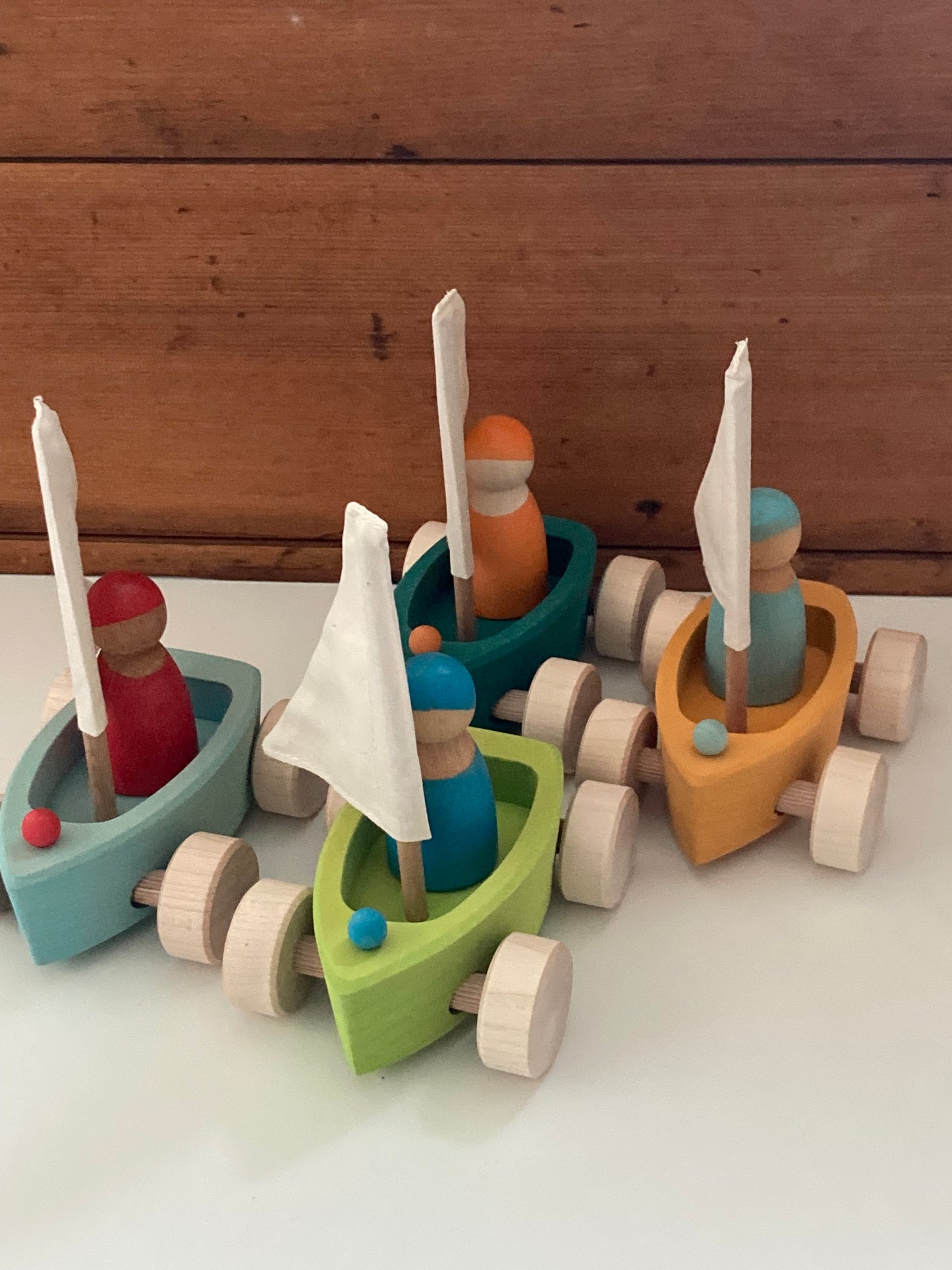 Wooden Toy - Grimm's SAILBOATS, on wheels, each with SKIPPER! (set of 4)